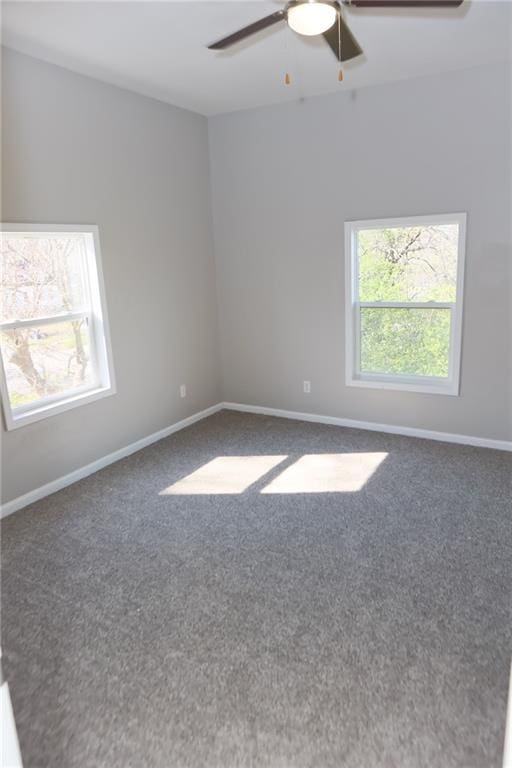 unfurnished room featuring ceiling fan and carpet floors