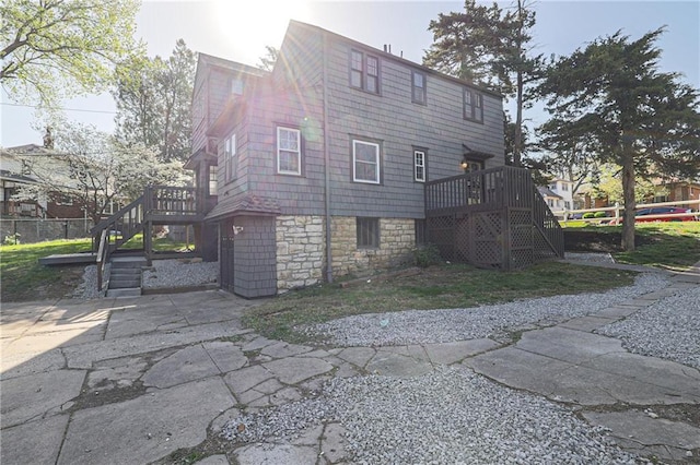 rear view of property with a deck