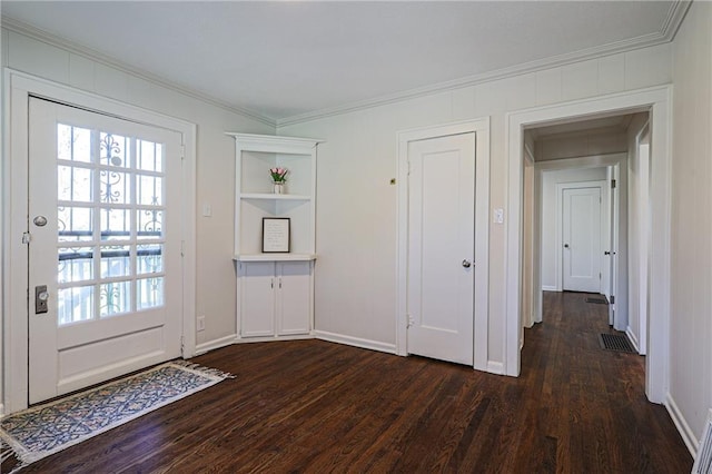 interior space with dark hardwood / wood-style floors and ornamental molding