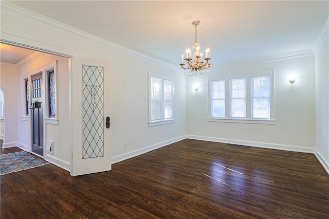 unfurnished room with ornamental molding, an inviting chandelier, and dark hardwood / wood-style flooring