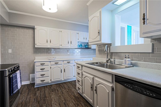 kitchen featuring sink, appliances with stainless steel finishes, white cabinets, backsplash, and dark wood-type flooring