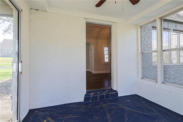 entrance to property with ceiling fan