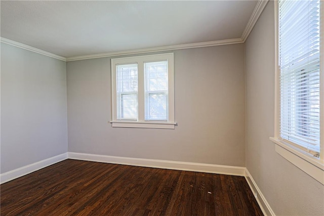 unfurnished room featuring dark hardwood / wood-style flooring and ornamental molding