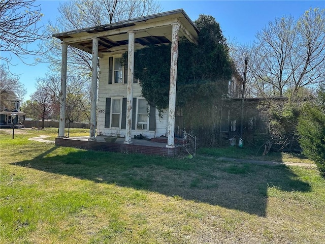 view of property exterior with a yard