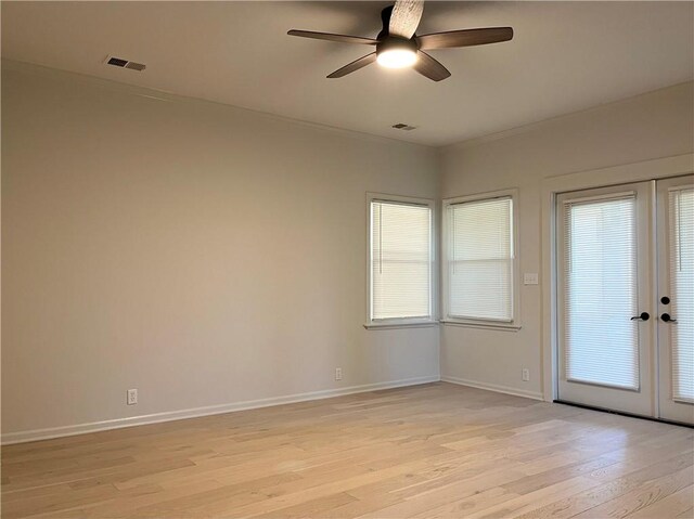 15523A W 303rd St, Paola, KS 66071 - unfurnished room featuring french doors, light hardwood / wood-style floors, and ceiling fan