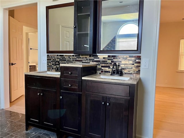 15523A W 303rd St, Paola, KS 66071 - bathroom featuring wood-type flooring, vanity, and tasteful backsplash