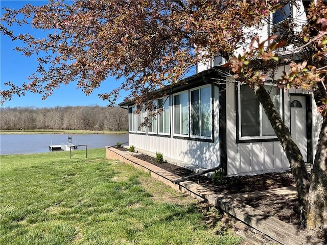 15523A W 303rd St, Paola, KS 66071 - view of property exterior with a lawn and a water view