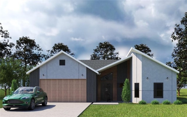 view of front of property featuring a front yard and a garage