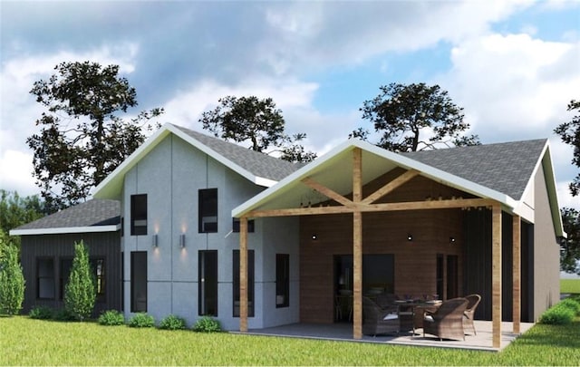 rear view of house with a patio area and a yard