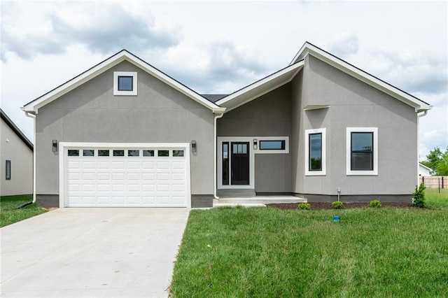149 S Linn Valley Dr, Linn Valley, KS 66040 - view of front of property with an attached garage, concrete driveway, a front lawn, and stucco siding