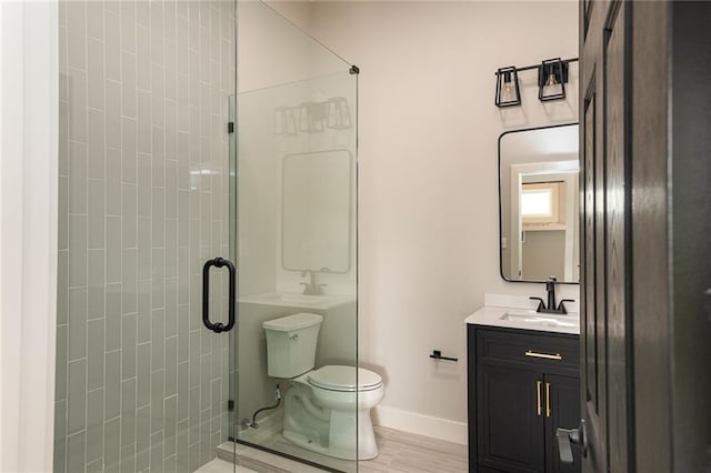 149 S Linn Valley Dr, Linn Valley, KS 66040 - full bath with a stall shower, toilet, baseboards, and vanity