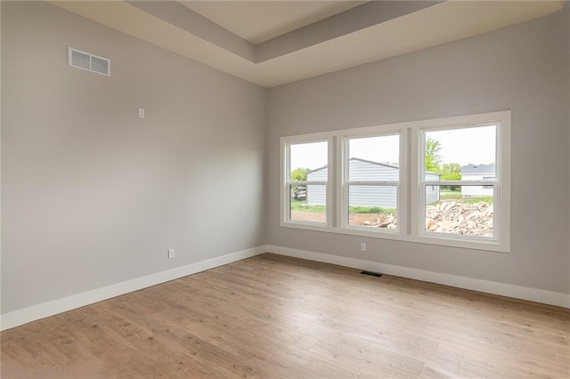 149 S Linn Valley Dr, Linn Valley, KS 66040 - unfurnished room featuring baseboards, plenty of natural light, and light wood-type flooring