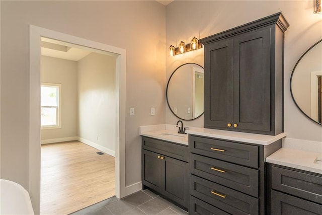 149 S Linn Valley Dr, Linn Valley, KS 66040 - full bathroom featuring two vanities, baseboards, and tile patterned floors