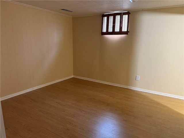 spare room featuring wood-type flooring