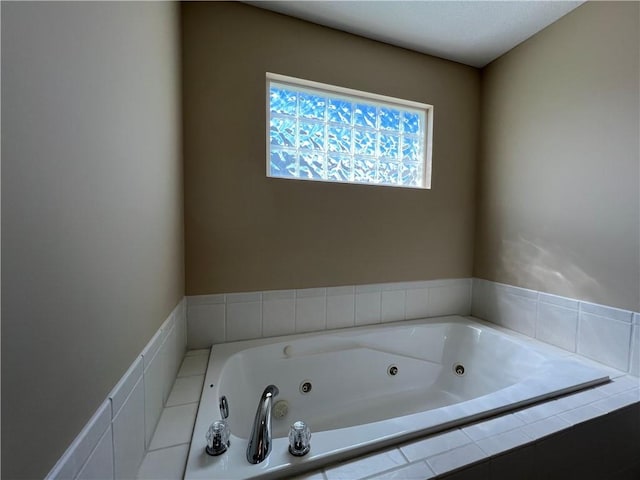 bathroom featuring tiled tub