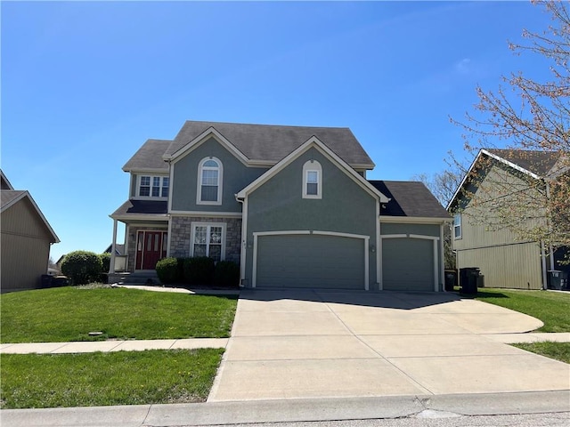 view of front of home featuring a garage and a front yard