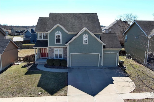 traditional-style home with stucco siding, concrete driveway, fence, stone siding, and a front lawn