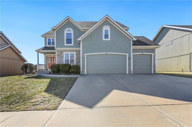 traditional-style home featuring stone siding, a front lawn, concrete driveway, and stucco siding