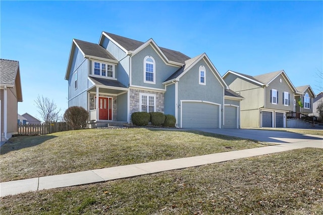 traditional-style house with driveway, stone siding, an attached garage, fence, and a front lawn