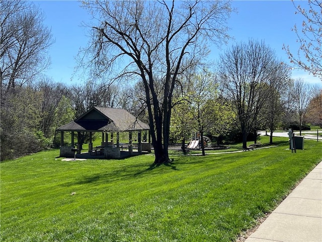 surrounding community with a yard and a gazebo