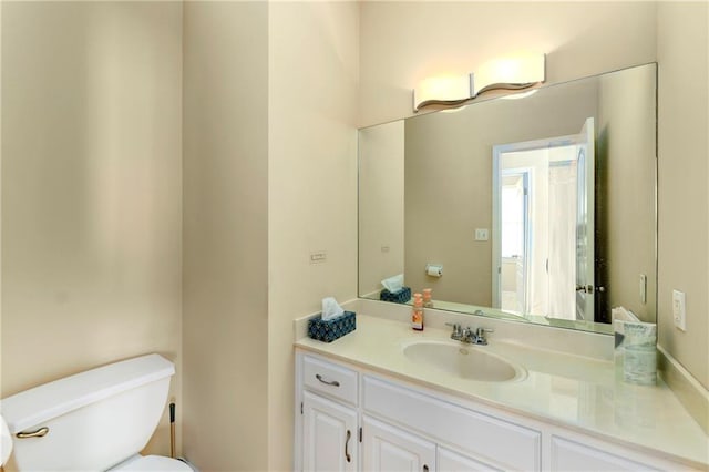 half bath with vanity and toilet