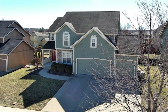 view of front of home featuring an attached garage, stone siding, driveway, stucco siding, and a front lawn