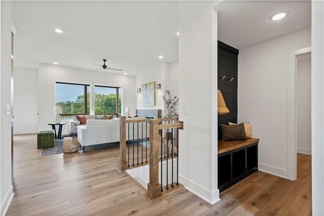 interior space featuring recessed lighting, baseboards, and light wood-style floors