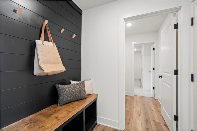 mudroom with light hardwood / wood-style floors