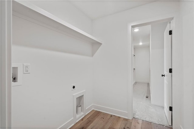 laundry room featuring hookup for a washing machine, light hardwood / wood-style floors, and electric dryer hookup