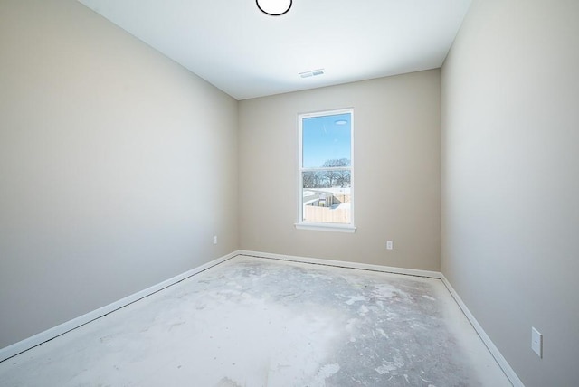 empty room featuring concrete flooring