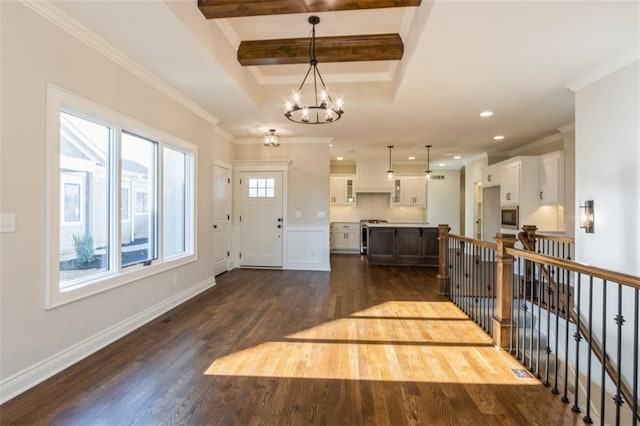 entrance foyer with crown molding, dark hardwood / wood-style floors, beam ceiling, and a notable chandelier