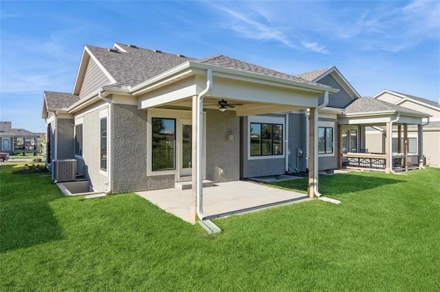 back of property with a patio, ceiling fan, and a lawn