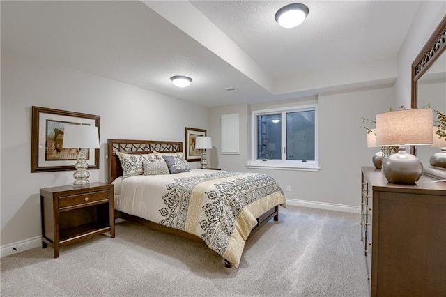 bedroom featuring light carpet