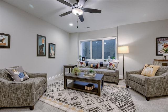 carpeted living room featuring ceiling fan