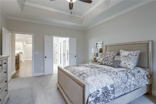 carpeted bedroom with ceiling fan, crown molding, and a raised ceiling