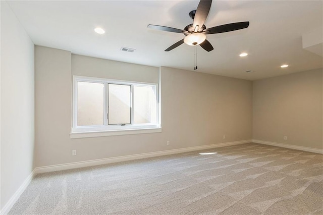 empty room with light carpet and ceiling fan