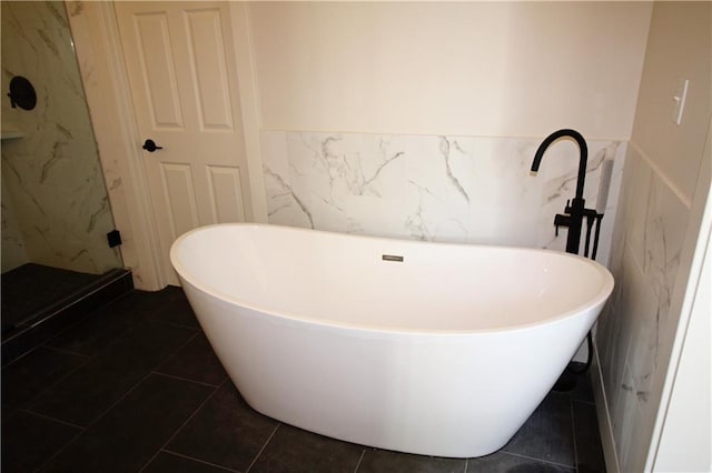 153 S Linn Valley Dr, Linn Valley, KS 66040 - full bathroom featuring tile walls, a wainscoted wall, a freestanding bath, and a shower stall