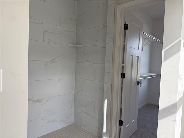 bathroom with tiled shower