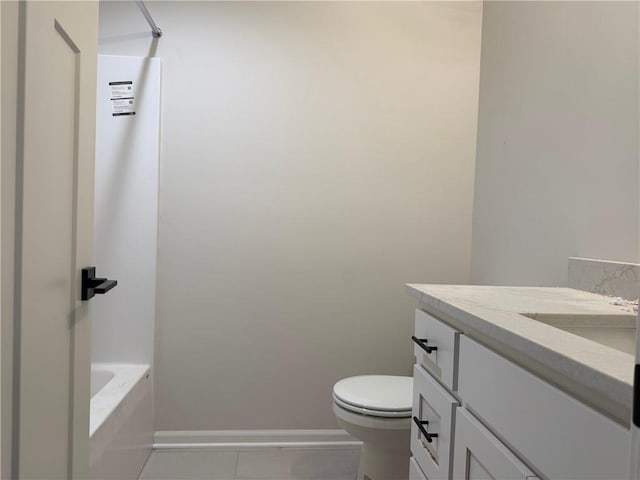 bathroom featuring tile patterned flooring, vanity, and toilet