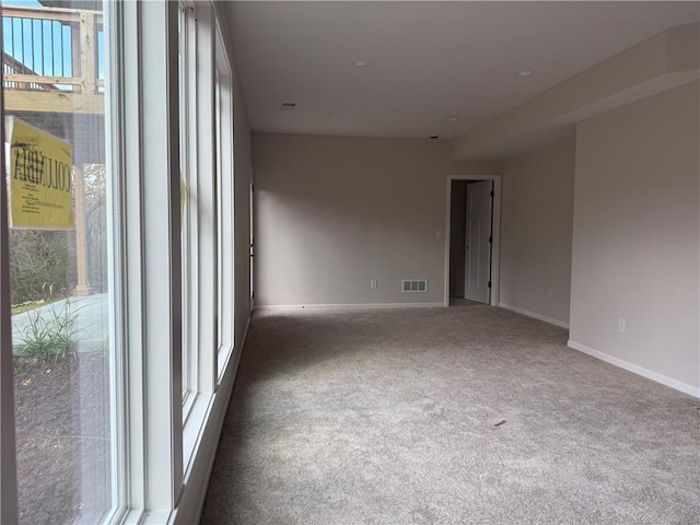 empty room featuring dark colored carpet