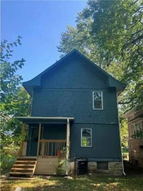 back of property featuring central AC and a porch