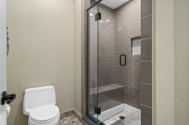 full bath with a shower stall and toilet