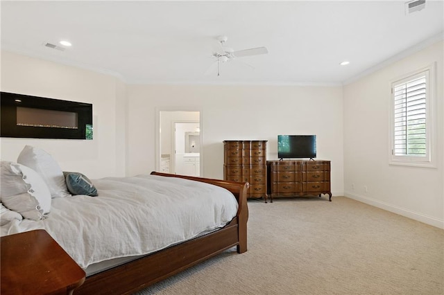 bedroom with light colored carpet, crown molding, visible vents, and baseboards