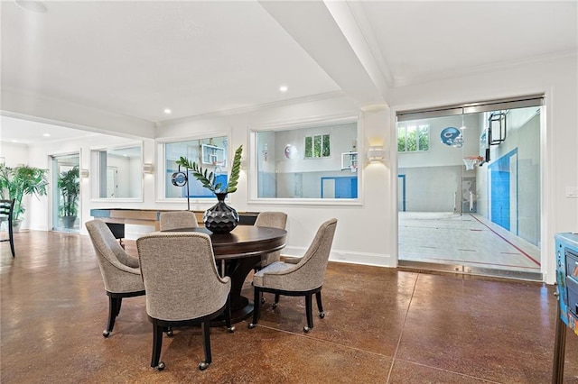 dining area with baseboards, recessed lighting, and crown molding