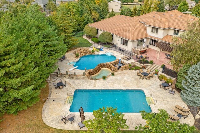 view of pool with fence, a fenced in pool, and a patio area