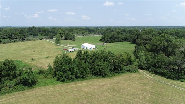 birds eye view of property with a rural view