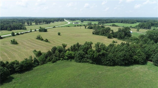 birds eye view of property featuring a rural view