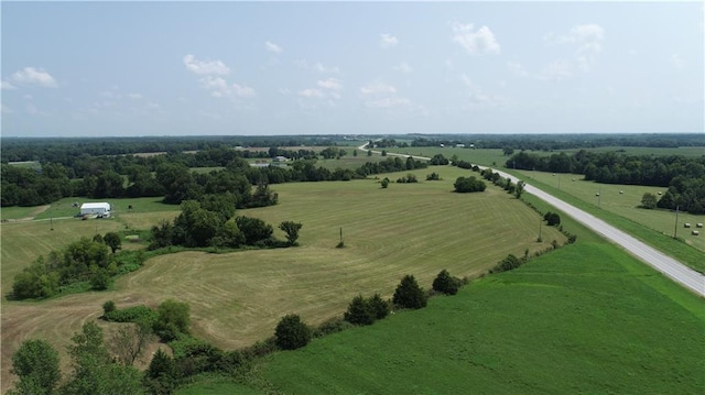 birds eye view of property with a rural view