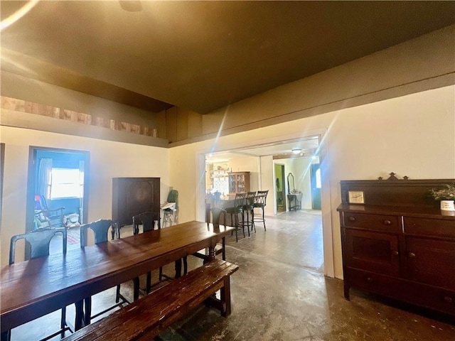 dining room with unfinished concrete floors