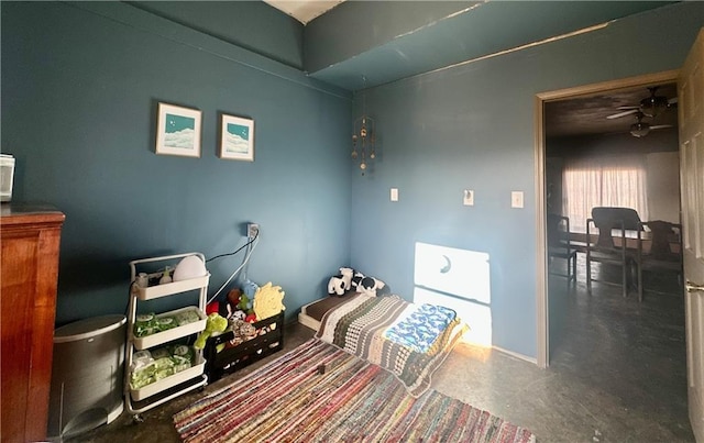 bedroom featuring concrete flooring